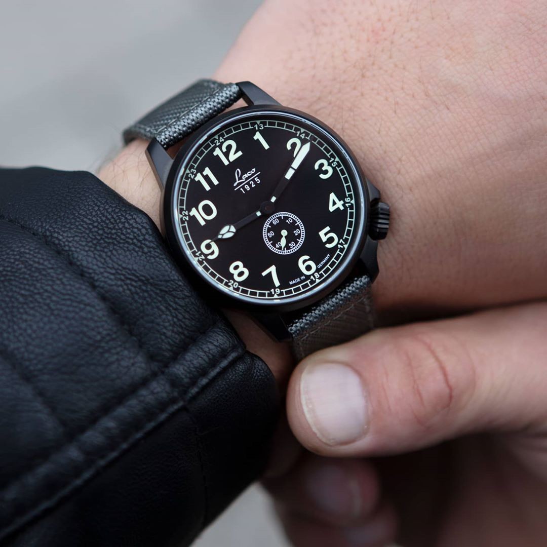 PILOT WATCHES SPECIAL MODELS - MODEL JU

This pilot watch is made of mat sandblasted stainless steel and plated with black PVD. It's crown is placed between 4 and 5h. It comes with a grey Nato strap which perfectly fits the dark case. 
@laco1925 #laco #lacowatches #mylacotime #lacowatch #laco1925 #pilotwatch #watchgeek #lacopilot #leatherjacket #watchesoftheday #timepiece #watch #black #watchfam #madeingermany #watchesofinstagram  #aviatorwatch #watchlover #pilot #fliegeruhr #aviator #uhren #specialmodel