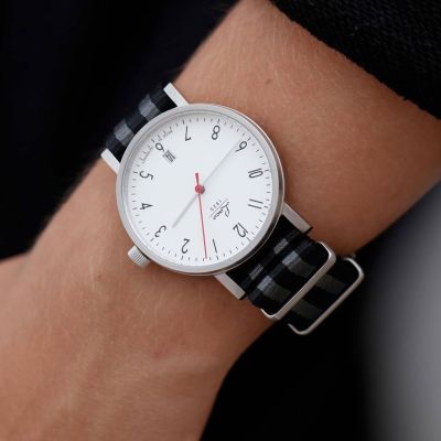 CLASSICS - MODEL DRESDEN 38 

That watch has a black grey striped nylon strap. The red second hand fits perfectly on the silver white dial.

@laco1925 #laco #lacowatches #laco1925 #mylacotime #classic #watchesofinstagram #outfit #basic #madeingermany #beige #coffee #uhren #classy #timepiece #potd #watchfam #ootd #lacoclassics #summer #watchesoftheday #outinspiration #watchgeek #watches #watchlover